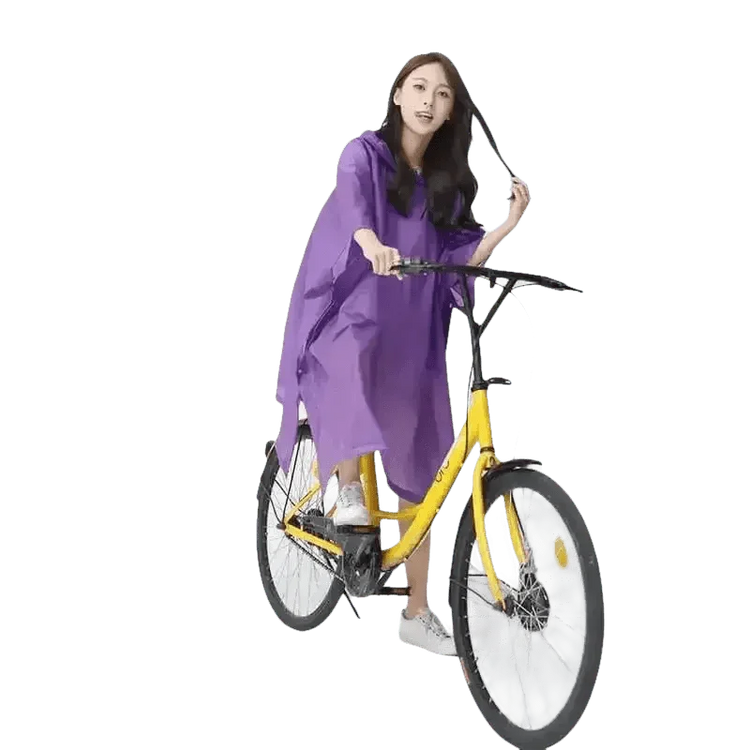 Woman in Colorful Waterproof Long Raincoat on Yellow Bicycle - GiFTiFY