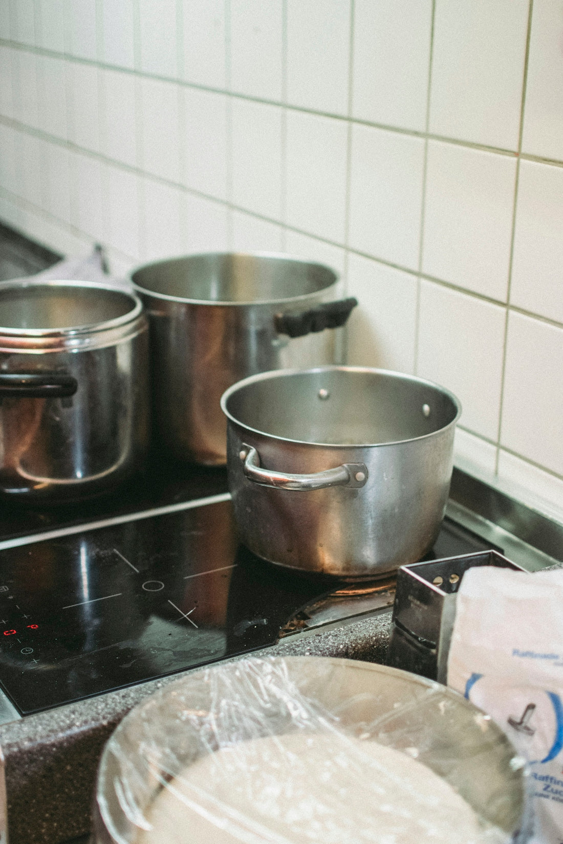 stainless steel cooking pots on stove