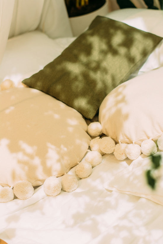 white and brown heart pillow