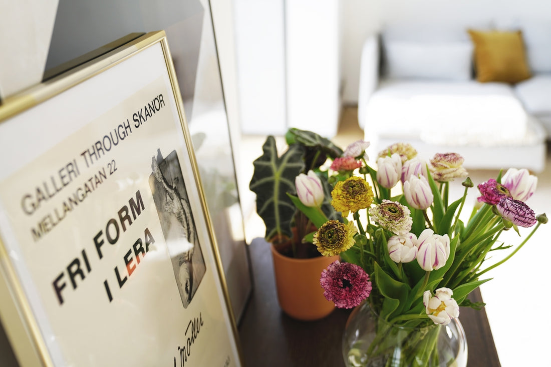 a vase filled with flowers sitting on top of a table