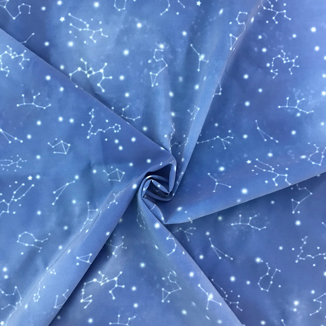 a blue fabric with white stars on it