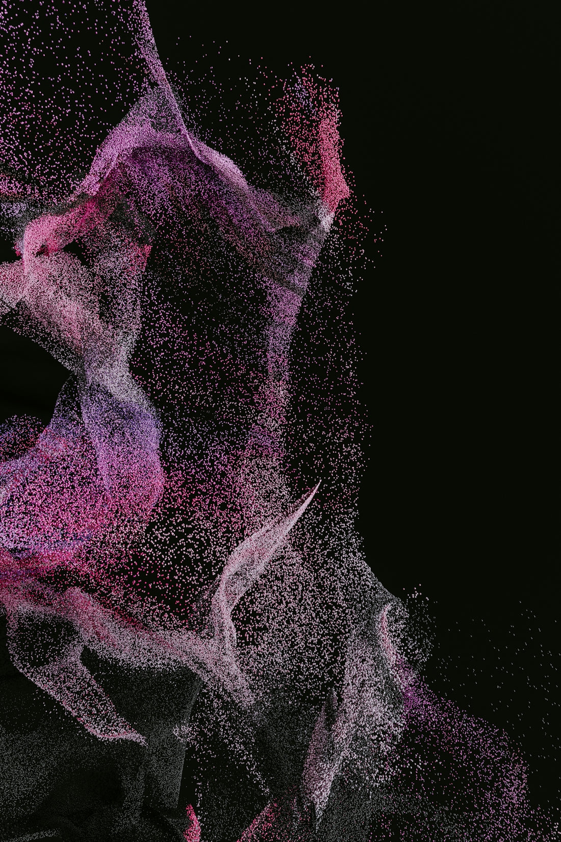 A swirling cloud of pink and purple particles against a black background