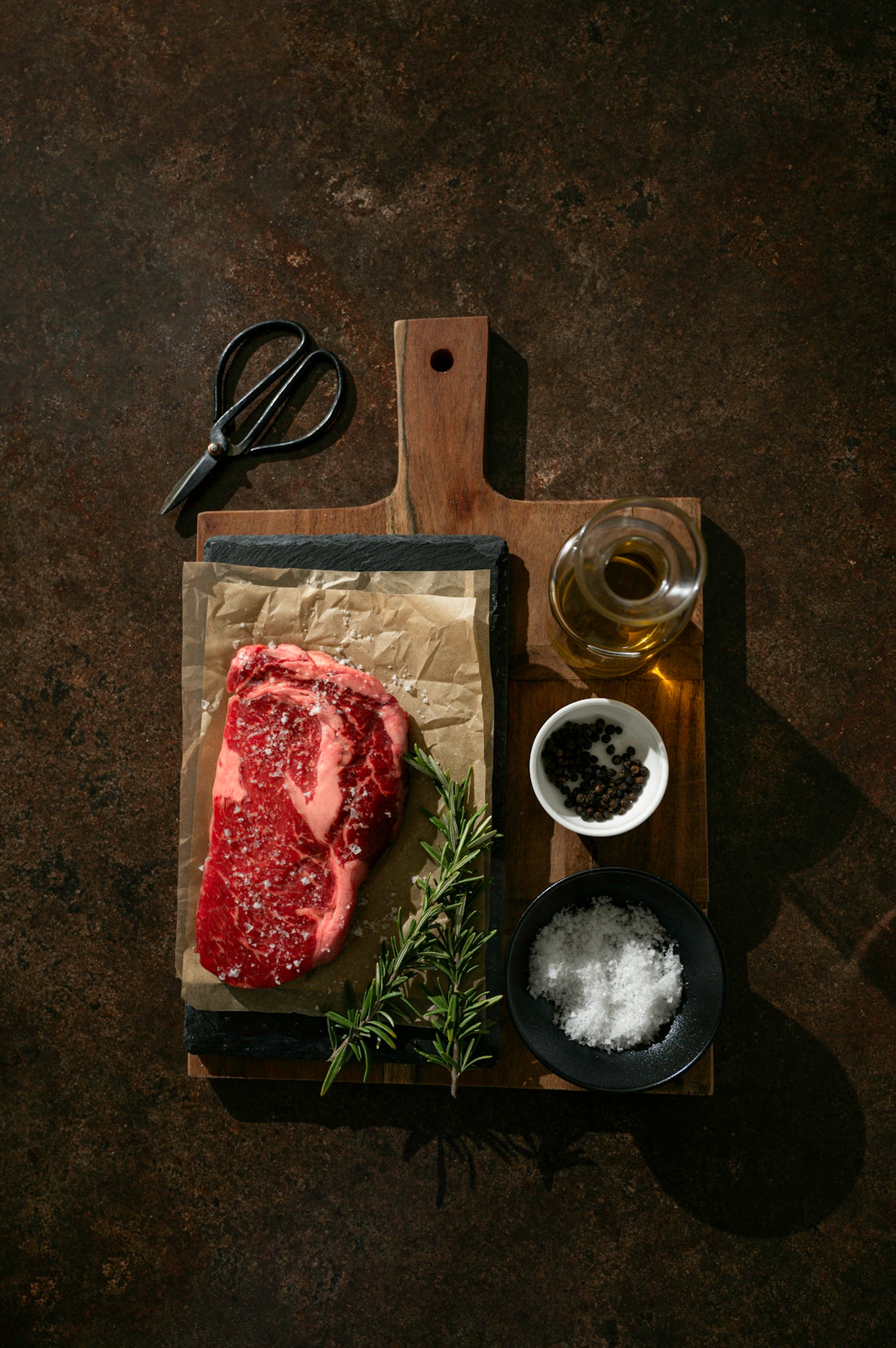 a piece of meat sitting on top of a cutting board