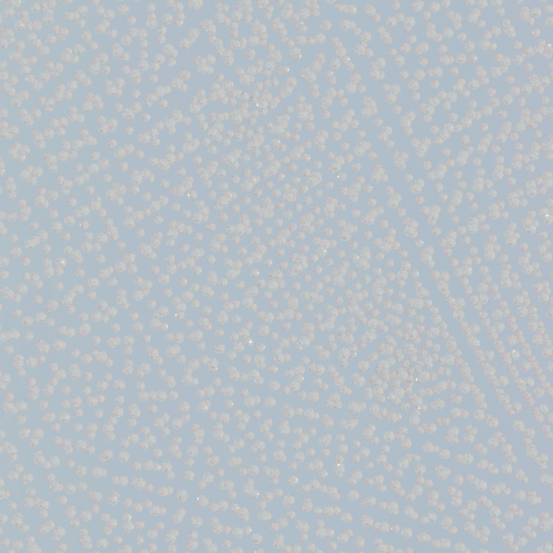 a blue and white background with small white dots