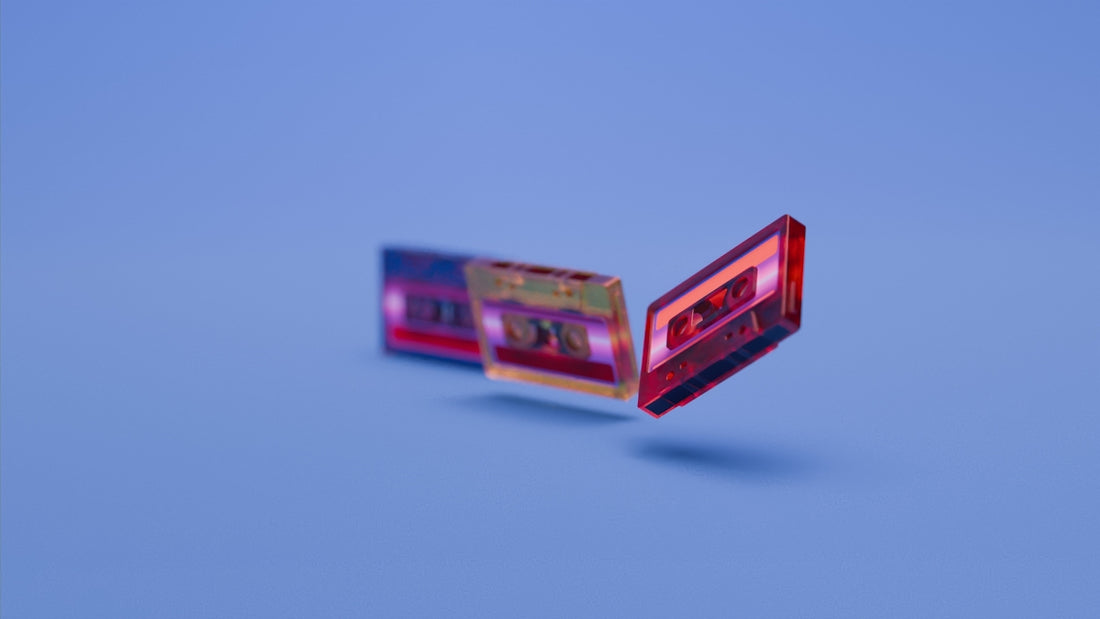 Three colorful cassette tapes hover on a blue background.