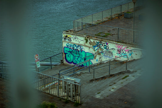 Graffiti on a concrete wall by the water