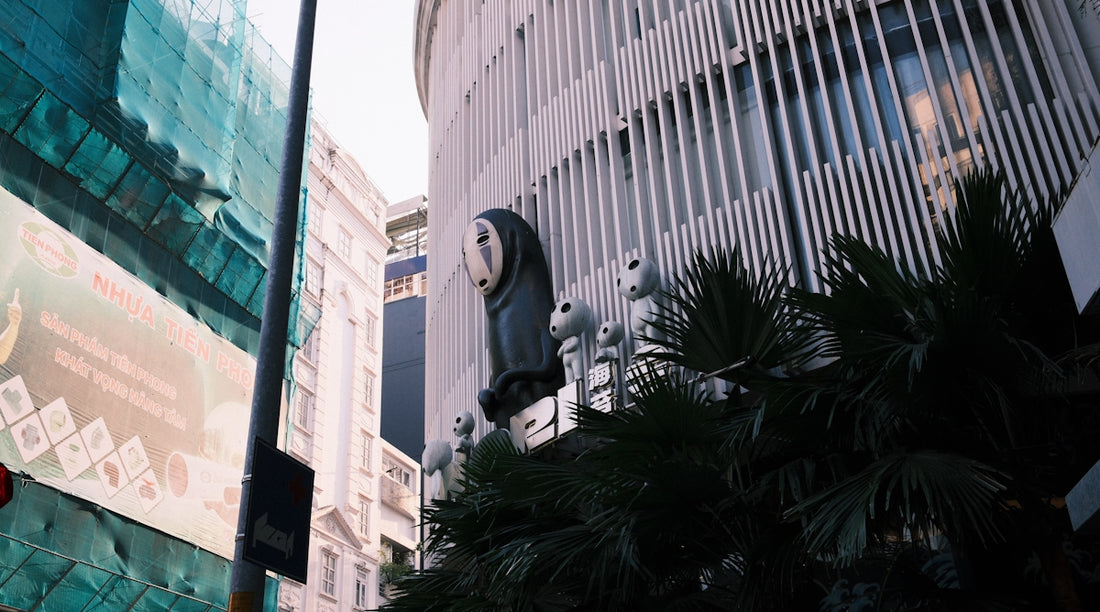 Building with unique facade and tropical plants