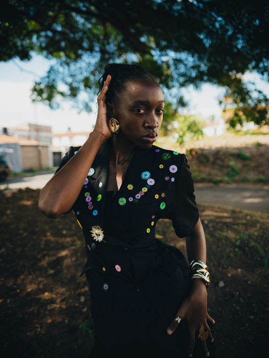 Woman with colorful embellishments on black jacket