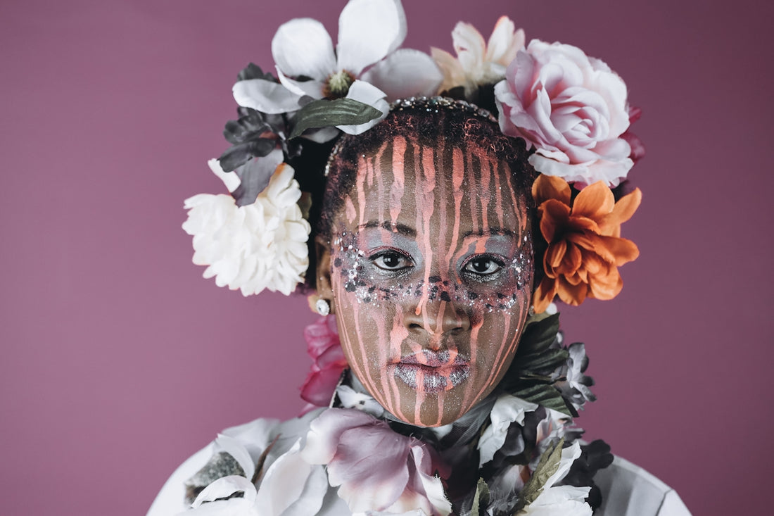 Woman with floral headdress and face paint