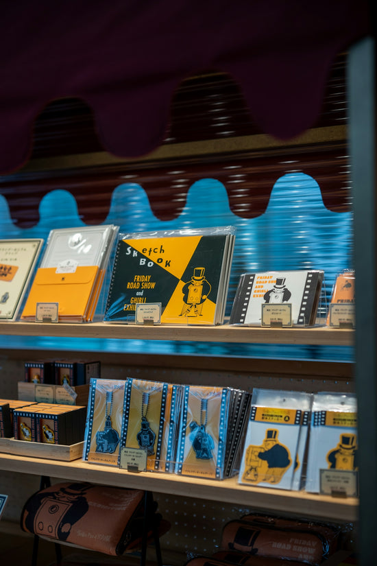 Sketchbooks and other stationery items on shelves