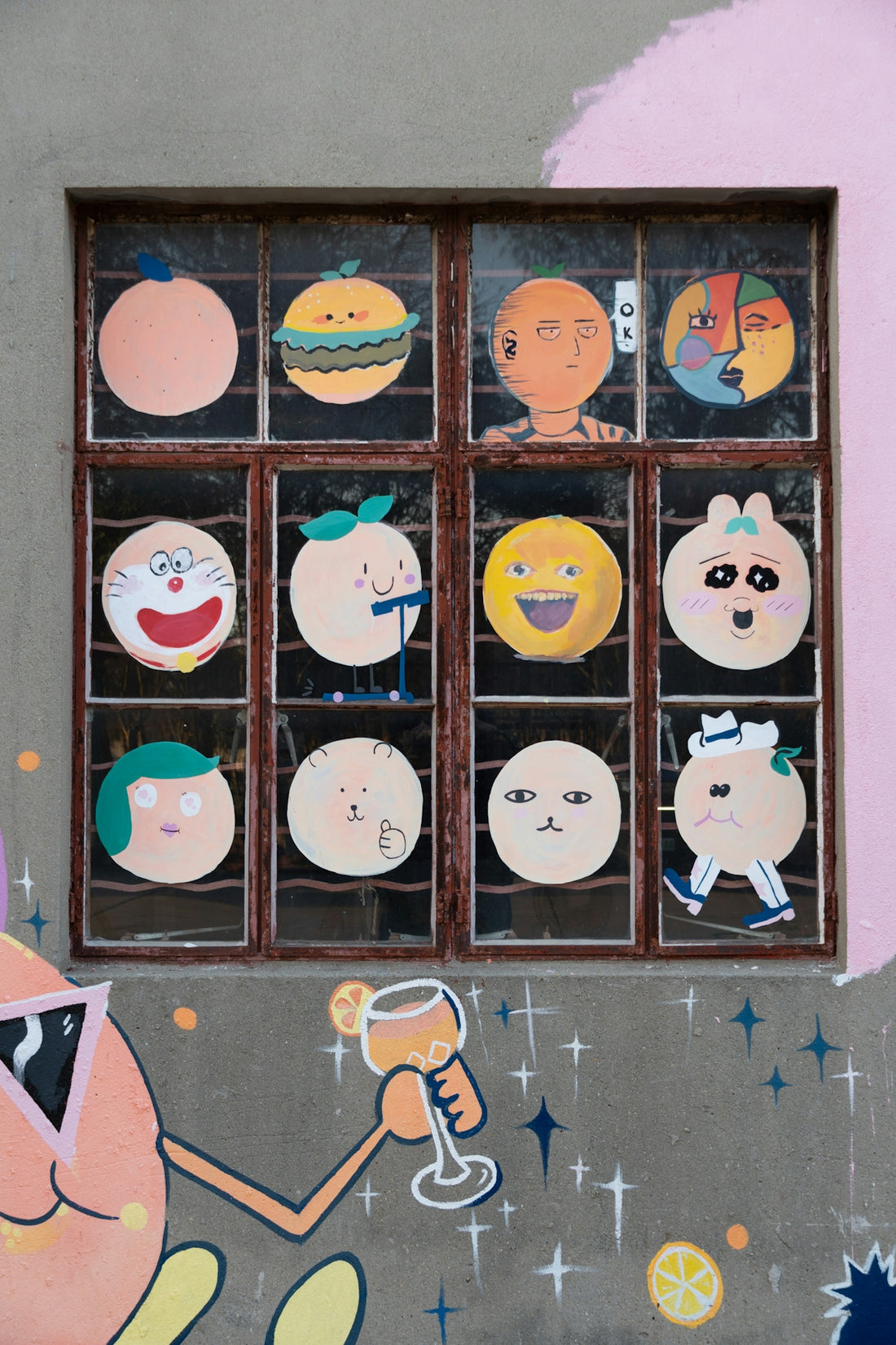 Cartoon faces and characters displayed on a window.
