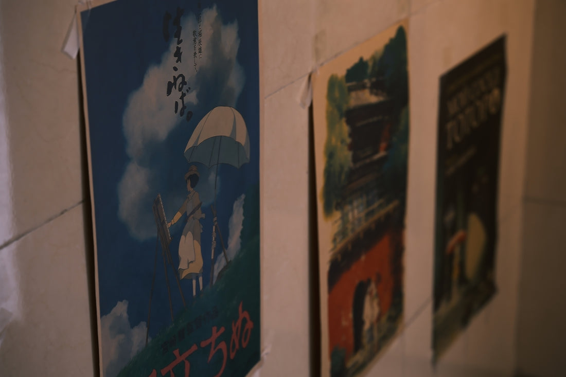 Three posters hanging on a wall