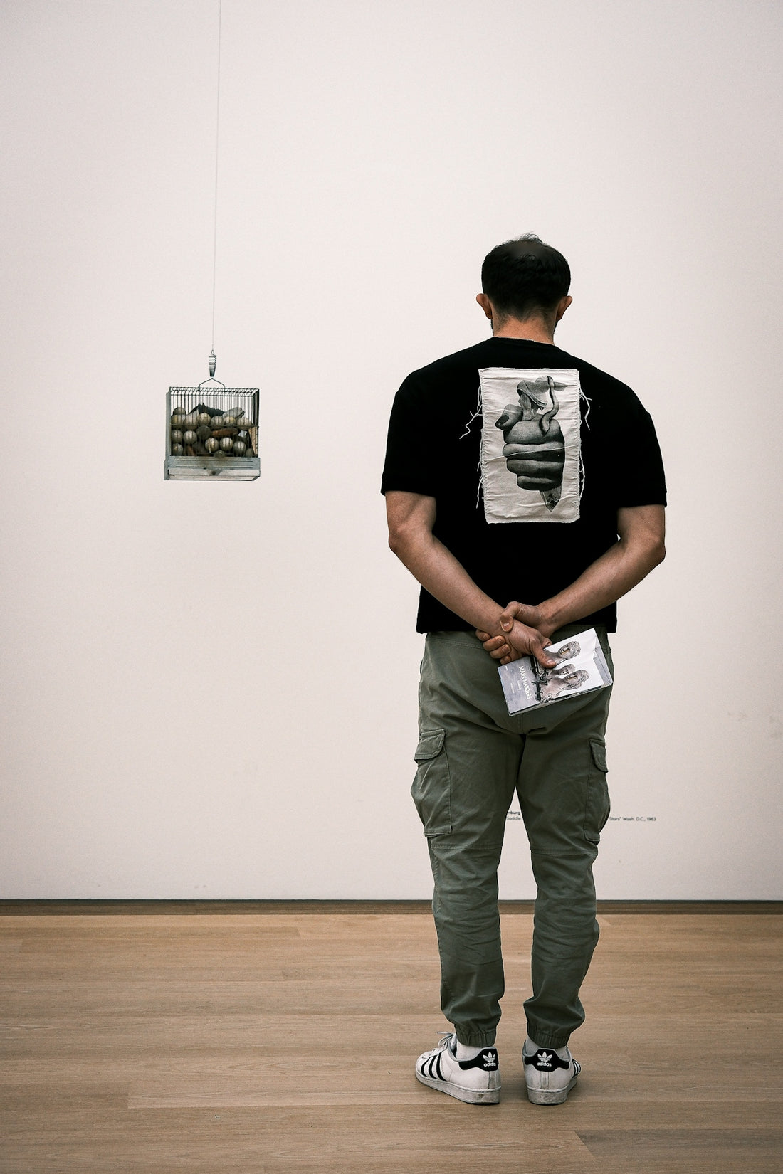Man looks at artwork in a museum