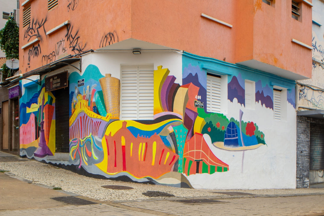 Corner building with vibrant, abstract street art mural.