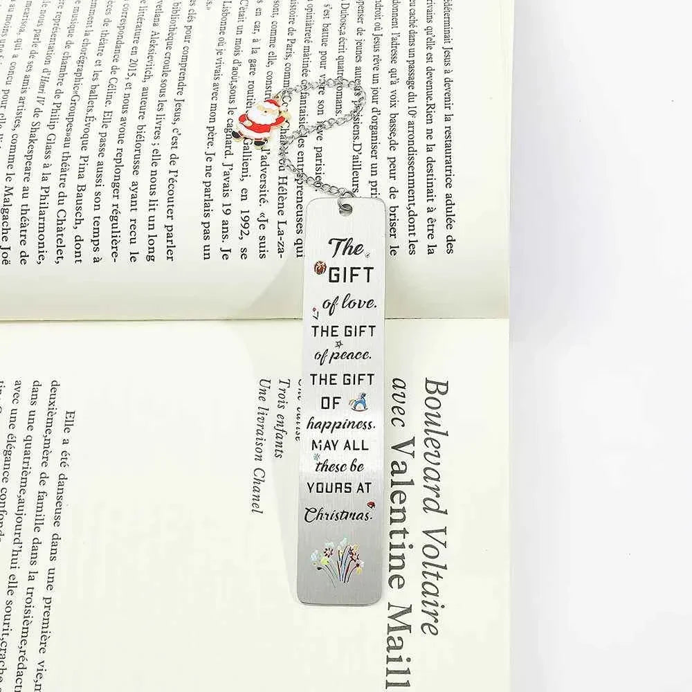 A stainless steel pendant bookmark about Christmas, the warmest Christmas reading gift for loved ones on Christmas Eve.