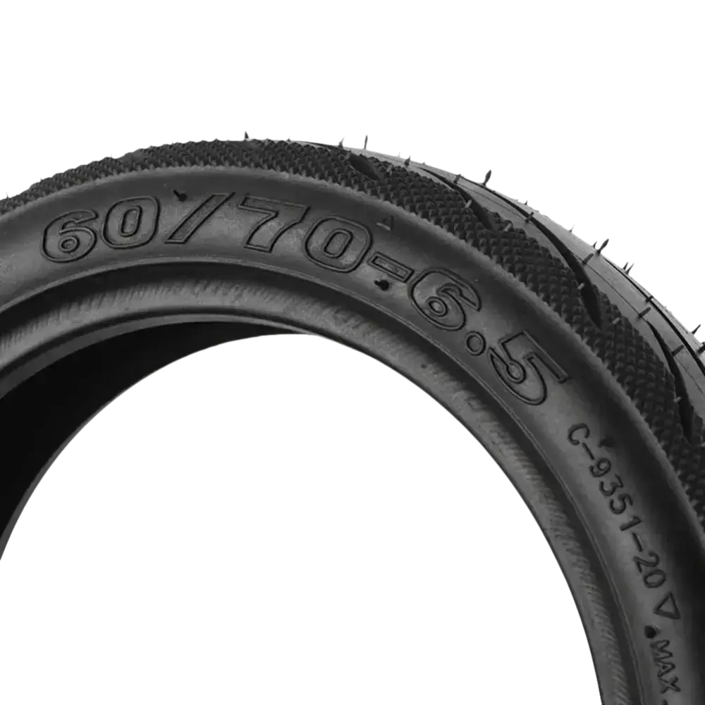 Black tire with tread.