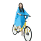 Woman in Colorful Waterproof Long Raincoat on Yellow Bicycle - GiFTiFY