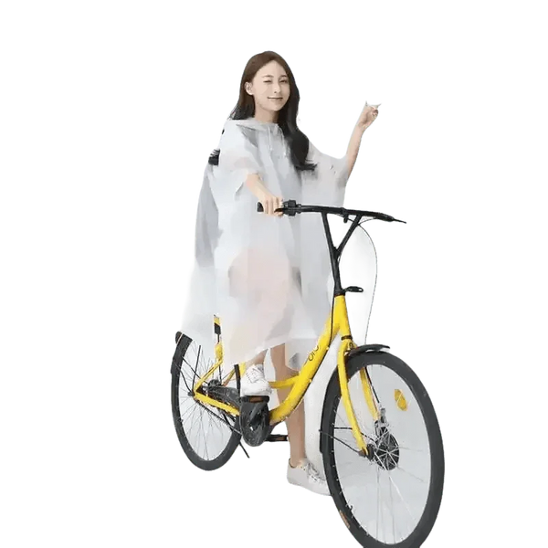 Woman in Colorful Waterproof Long Raincoat on Yellow Bicycle - GiFTiFY