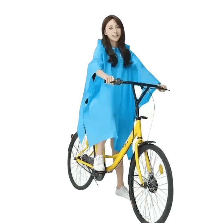 Woman in Colorful Waterproof Long Raincoat on Yellow Bicycle - GiFTiFY