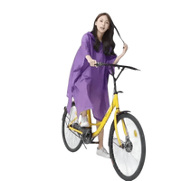 Woman in Colorful Waterproof Long Raincoat on Yellow Bicycle